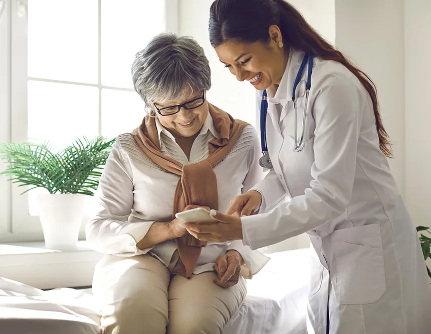 A clinician reviewing information with a patient during an appointment