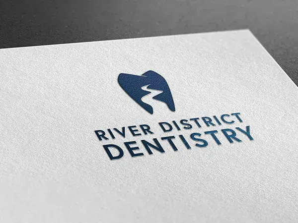 River District Dentistry logo and brand identity by HealthOne Websites